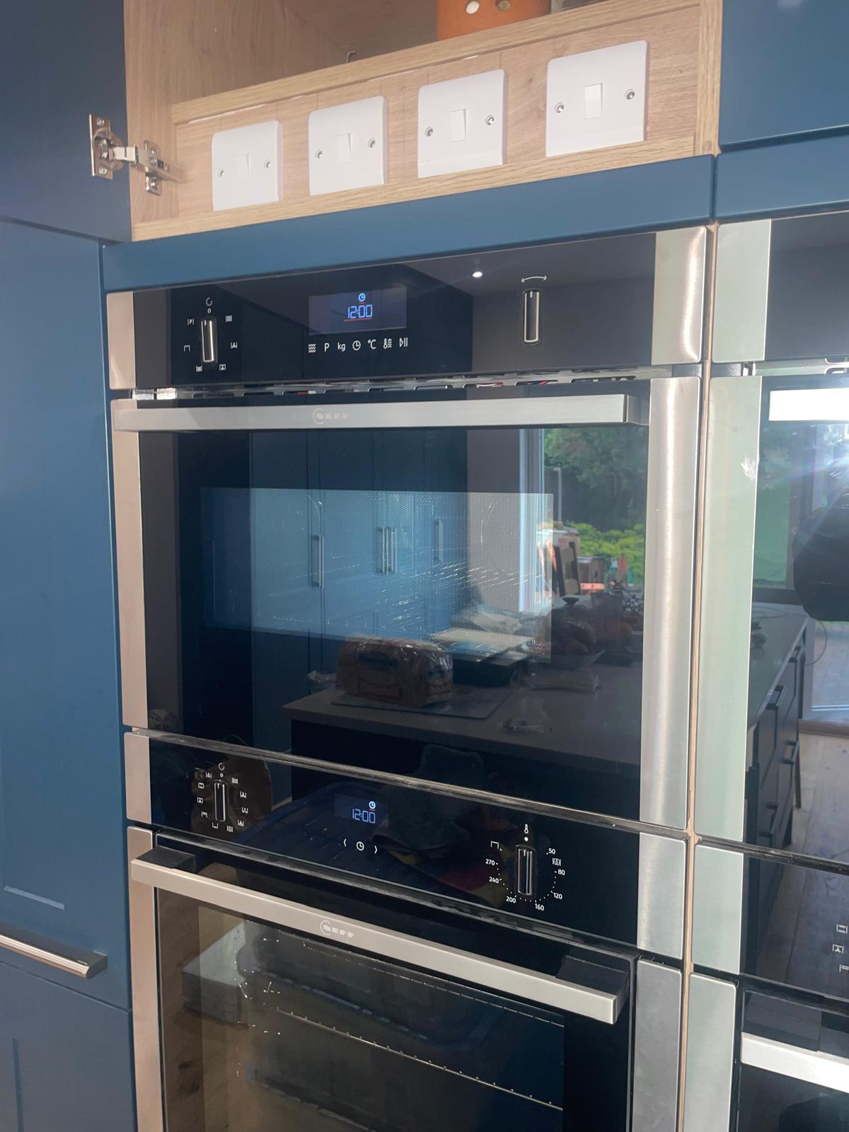 Kitchen appliance switching and integrated oven electrical supply