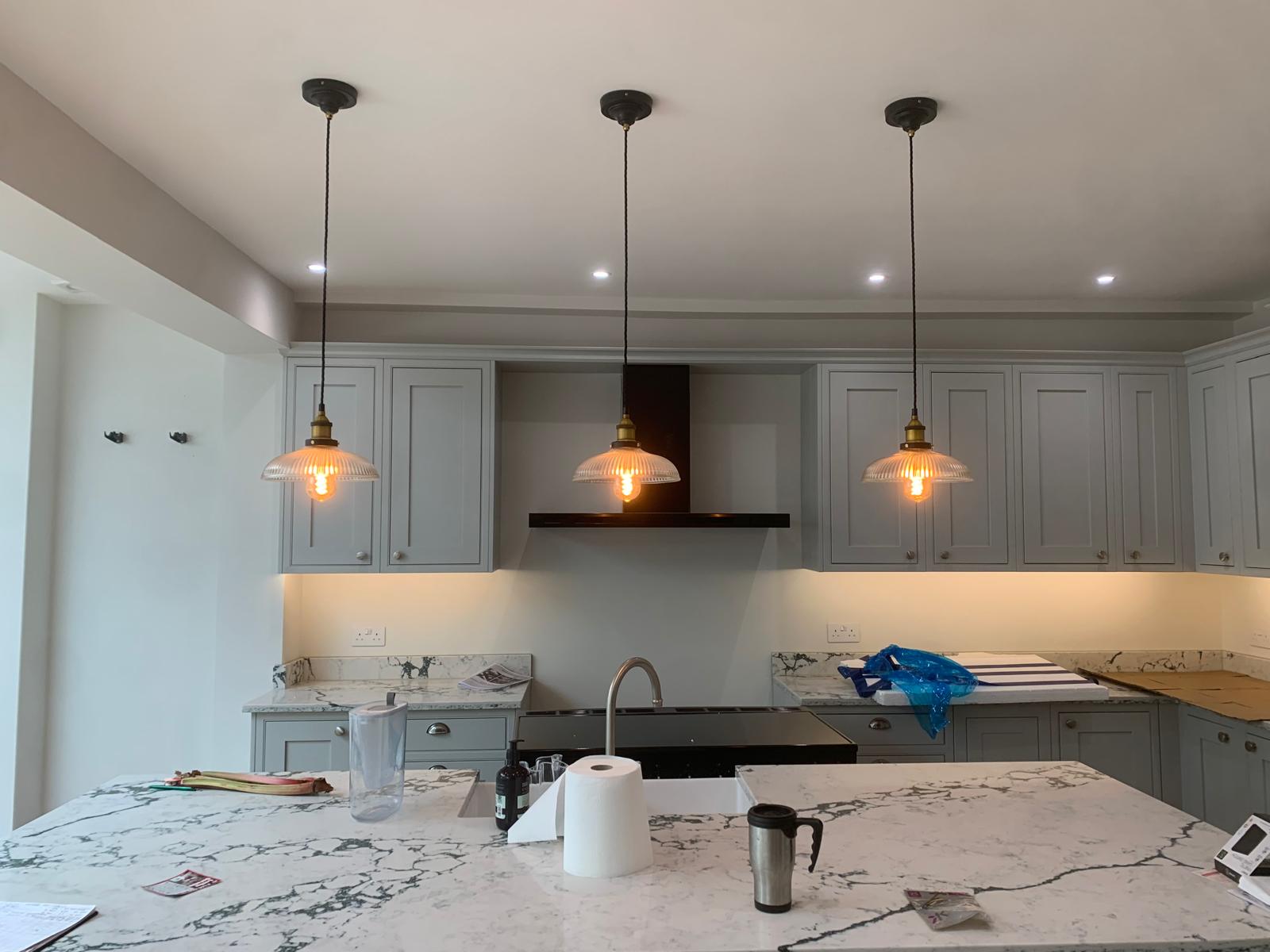 Kitchen pendant lights, recessed downlights and under-cabinet lighting after electrical installation